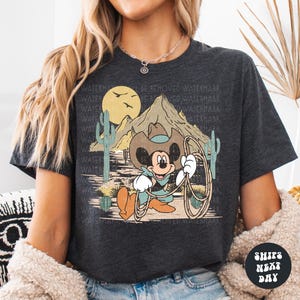 a woman wearing a mickey mouse t - shirt
