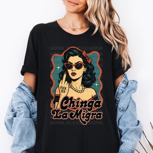 a woman wearing a black shirt with a picture of a woman wearing sunglasses