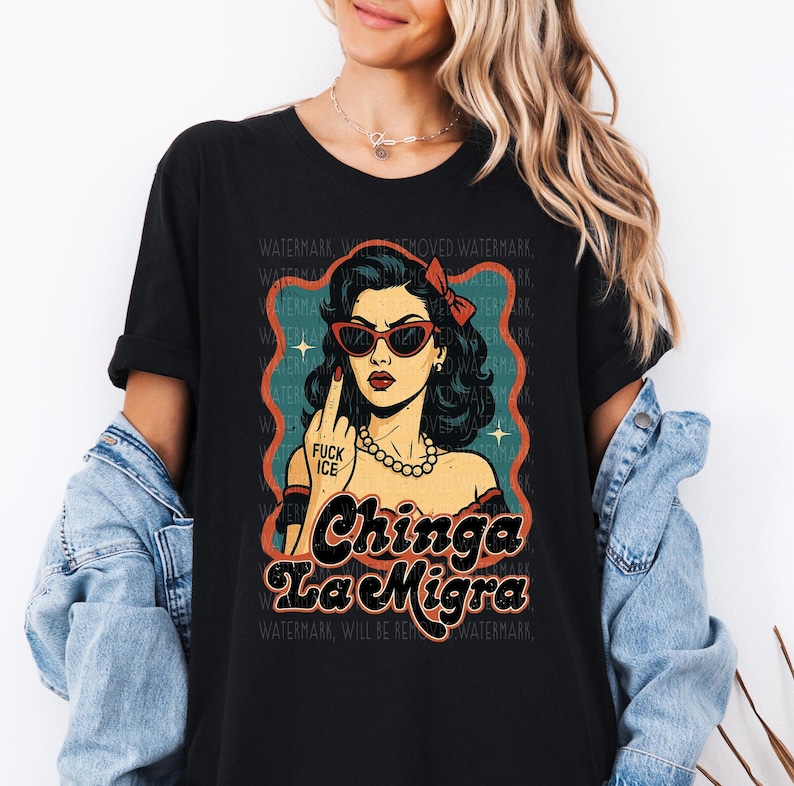 a woman wearing a black shirt with a picture of a woman wearing sunglasses