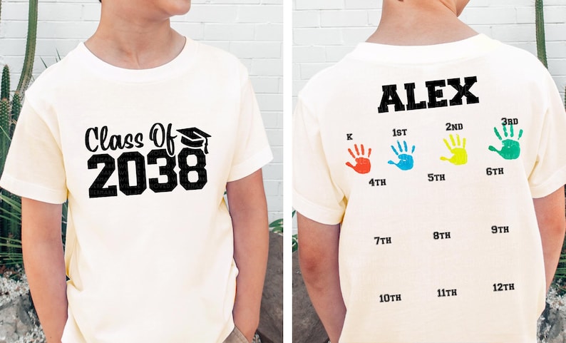 a young boy wearing a class of 208 shirt