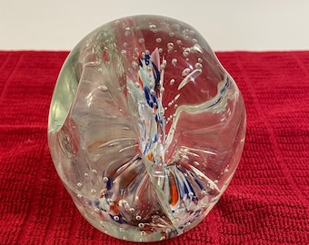 Glass Paper weight, inside white, red and blue colors. 4 inches tall.