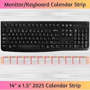 May include: A black computer keyboard with a calendar strip for the year 2025. The calendar strip is 14 inches by 1.5 inches and has a pink and orange color scheme.
