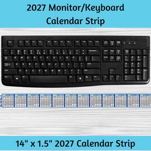 May include: A black computer keyboard positioned above a 14 inch by 1.5 inch 2027 calendar strip. The strip features twelve individual monthly grids arranged horizontally, with the year 2027 printed on both the left and right ends of the strip.