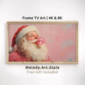 May include: A framed painting of Santa Claus blowing a pink bubble with a pink background. The painting is in a light wood frame. The text "Melody Art Style" and "Free Gift Included" is below the frame.