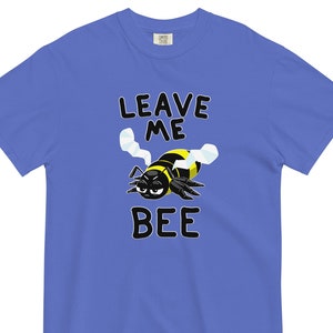 May include: A royal blue t-shirt with a cartoon bee and the text "Leave Me Bee".