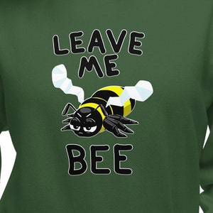 May include: Green sweatshirt with a cartoon bee and the text "Leave Me Bee".