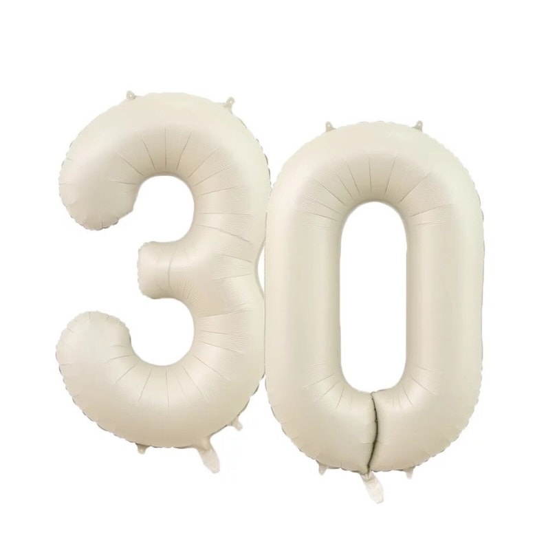 May include: Two large, cream-colored, foil number balloons, forming the number 30.