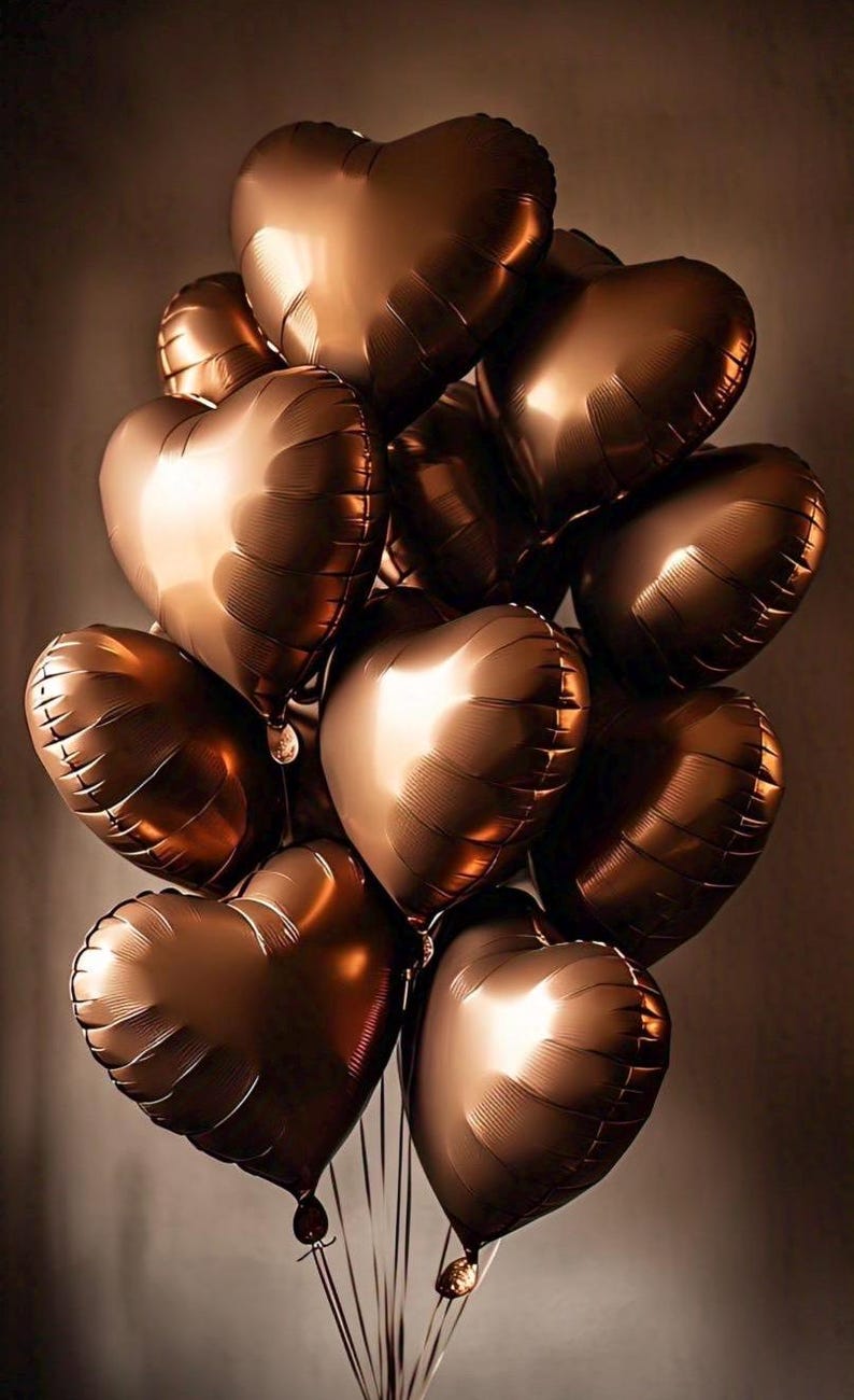 May include: A bouquet of brown heart-shaped balloons.