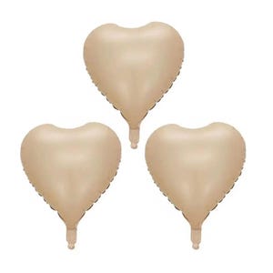 May include: Three gold heart-shaped balloons. The balloons are inflated and ready to be used for a party or celebration.