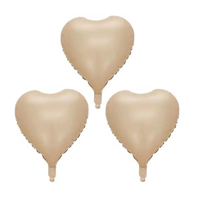 May include: Three gold heart-shaped balloons. The balloons are inflated and ready to be used for a party or celebration.