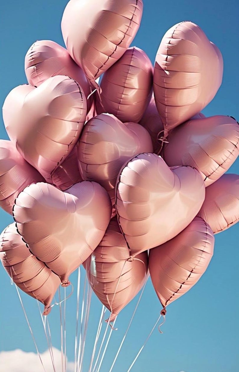 May include: A bunch of pink heart-shaped balloons against a blue sky.
