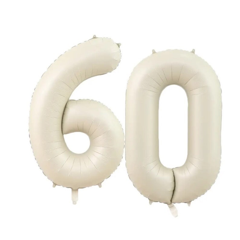 May include: Two large, cream-colored, foil number balloons, forming the number 60.