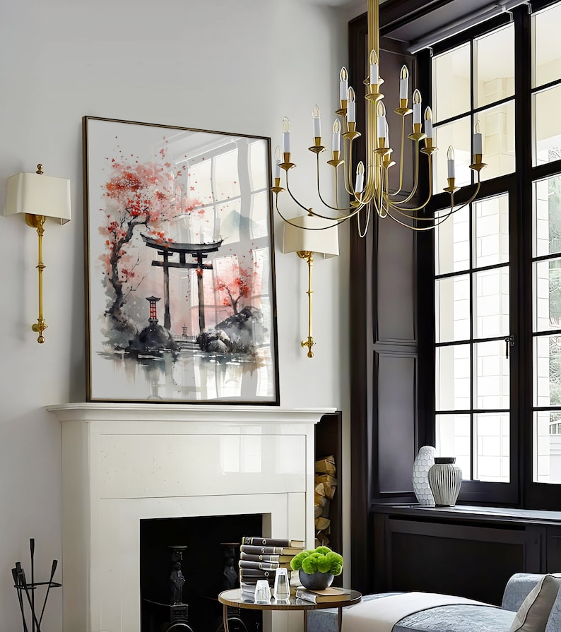 May include: A watercolor painting of a Japanese garden scene with a red torii gate, cherry blossoms, and a mountain in the background. The painting is framed in a simple black frame and hangs above a white fireplace.