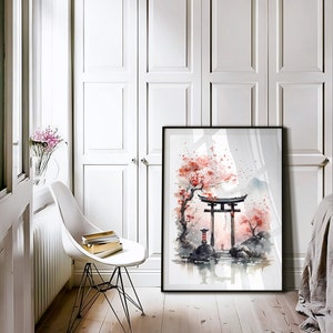 May include: A framed watercolor painting of a Japanese garden scene with a red torii gate, cherry blossoms, and a pond. The painting is in a black frame and is hanging on a white wall.