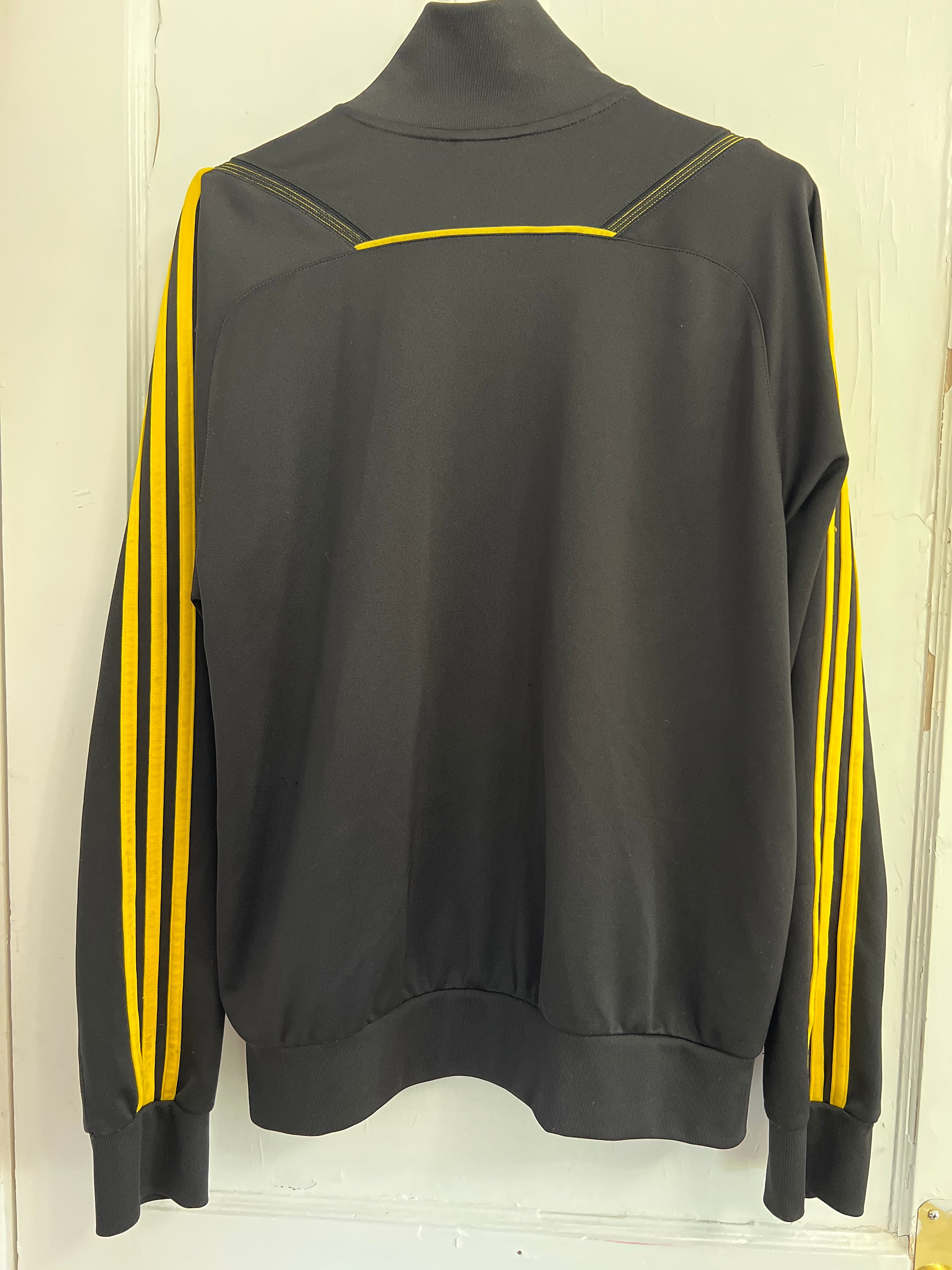 Black adidas jacket with yellow stripes deals