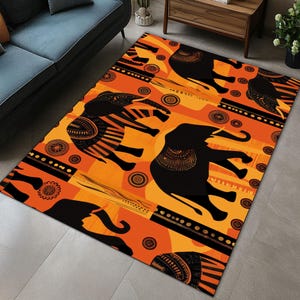 May include: Orange and black area rug with a repeating pattern of stylized elephants. The elephants are black with intricate patterns and are set against a bright orange background.