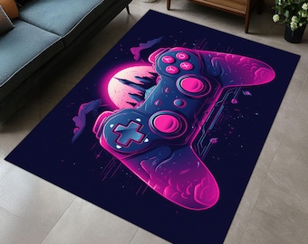May include: A dark blue rug with a pink and blue video game controller design. The controller is set against a dark blue background with a pink glow around it.