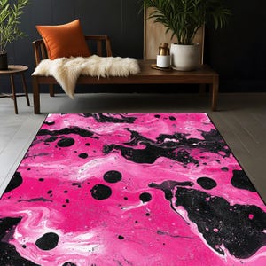 May include: A striking area rug with an abstract design. The rug features a bold combination of hot pink and black, with swirling patterns and large circular accents. This rug adds a modern touch to any living space.