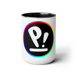 May include: White ceramic mug with a black rim and a black circle with a rainbow outline. The circle contains a white "P!" with a black line underneath.