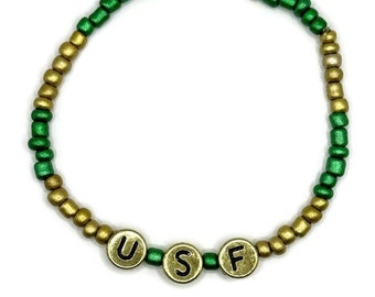 University of South Florida 3mm Green and Gold Beaded Elastic Bracelet