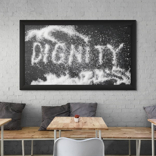 Salted Dignity. Photo of the word "Dignity" spelled with kosher salt on black slate with extra salt sprinkled on top. Food photography print