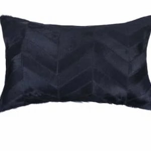 May include: A black chevron patterned throw pillow made of cowhide.