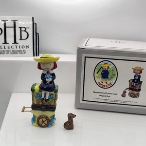Madeline on flower cart with dog trinket porcelain hinged box. Made by Midwest of Cannon Falls.