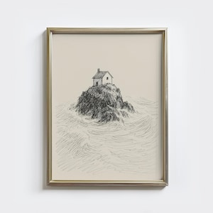 Puede incluir: Dibujo a pluma y tinta enmarcado de una pequeña casa en una isla rocosa rodeada de agua. La obra de arte, en un marco dorado, presenta un estilo minimalista con un detallado trabajo de líneas.