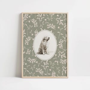 May include: A framed print with a detailed illustration of a Golden Retriever dog in an oval frame. The background is sage green with a delicate floral pattern. The artwork is encased in a light wood frame.