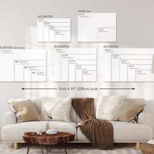 May include: A diagram showing different canvas sizes and ratios for artwork, with a sofa in the foreground. The text on the diagram reads "7:5 RATIO (ISO sizes)", "A1 33.1x23.4", "A2 23.4x16.5", "A3 16.5x11.7", "A4 11.7x8.3", "4:3 RATIO", "24x18", "20x15", "16x12", "12x9", "5:4 RATIO", "30x24", "25x20", "20x16", "15x12", "10x8", "14x11 inch", "20x22", "14x11", "3:2 RATIO", "36x26", "30x20", "24x16", "18x12", "12x8", "Sofa is 90" (228cm) wide".