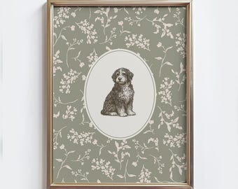 May include: Framed print featuring a detailed illustration of a seated dog within an oval frame. The dog is rendered in shades of gray and brown. The background is a muted green with a floral pattern, all encased in a gold-colored frame.