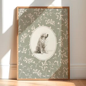 May include: A framed print with a detailed illustration of a Golden Retriever dog. The dog is in an oval frame, set against a sage green background with a white floral pattern. The wooden frame adds a classic touch.