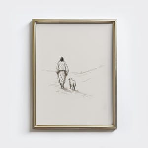 Op de afbeelding: Ingelijste zwart-witte schets van een figuur in een gewaad die met een schaap loopt. Het kunstwerk is geplaatst tegen een neutrale achtergrond, omlijst in een goudkleurige metalen lijst. De stijl is minimalistisch en roept een gevoel van vrede op.