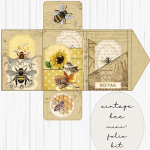 May include: A vintage bee-themed mini folio kit with a yellow and brown color scheme. The kit includes a variety of paper elements, including a sunflower, honeycomb, and bees. The text "vintage bee mini folio kit" is printed on a white circle.