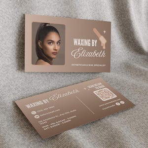 May include: Business cards for "Waxing by Elizabeth," an esthetician and wax specialist. The cards are a muted brown color and feature a photo of a woman, a waxing tool graphic, and contact information including a QR code.