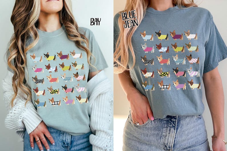 May include: Two t-shirts, one in bay and one in blue jean, each featuring a repeating pattern of dachshunds wearing various patterned sweaters. The shirts are short-sleeved and made of a soft material.
