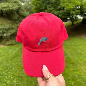 embroidered manatee hat, hat women baseball, baseball dad cap, cap animal design, design wildlife headwear, headwear adjustable strap, strap sea accessory, accessory ocean lover, lover marine gift, gift summer beach, beach casual style, style unstructured profile