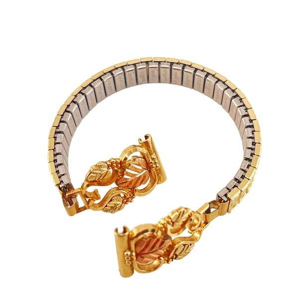 Bracelet-montre feuille de vigne bicolore en or 10 carats Black Hills avec bracelet extensible Spidel