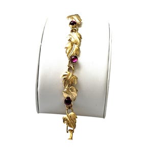 Pulsera Trifari de eslabones dorados con hojas y diamantes de imitación morados, joyería vintage