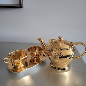 Gold plated Royal Winton Grimwades teapot, cream, sugar and tray