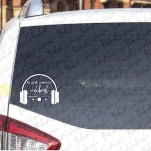 May include: White vinyl decal for a car window featuring the text "If I crash pause my audiobook" with a graphic of headphones and a media control bar. The decal is designed for audiobook lovers.