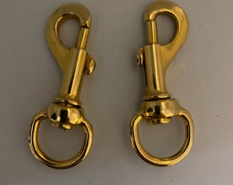 2 gold metal carabiners