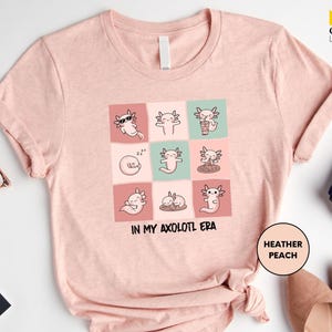 a t - shirt with a picture of cats on it