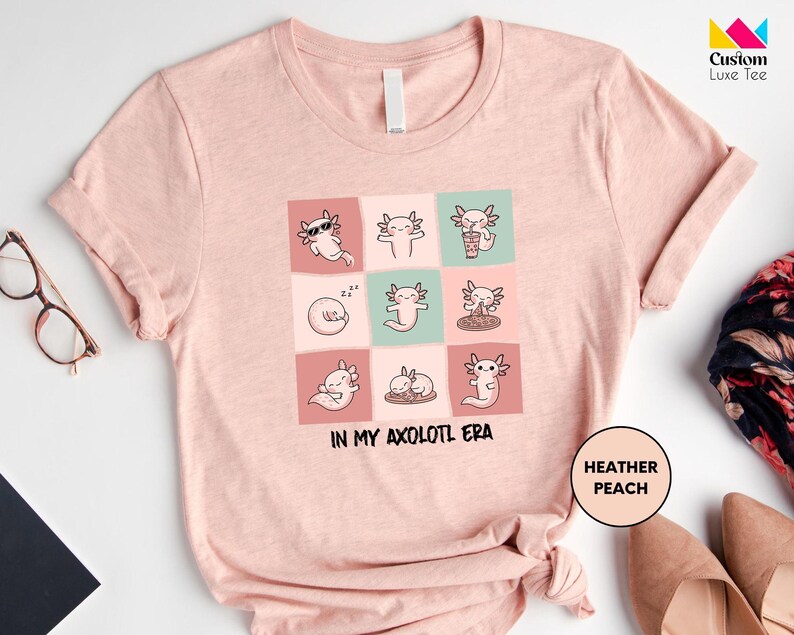 a t - shirt with a picture of cats on it