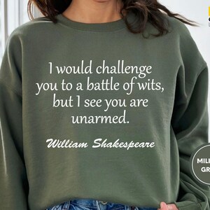 a woman wearing a sweatshirt that says i would challenge you to a battle of wits