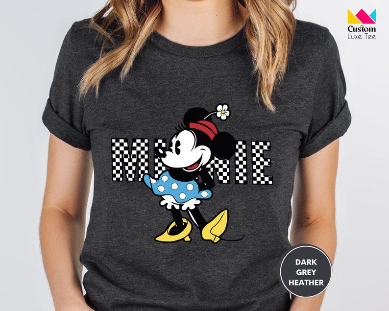 a woman wearing a mickey mouse t - shirt