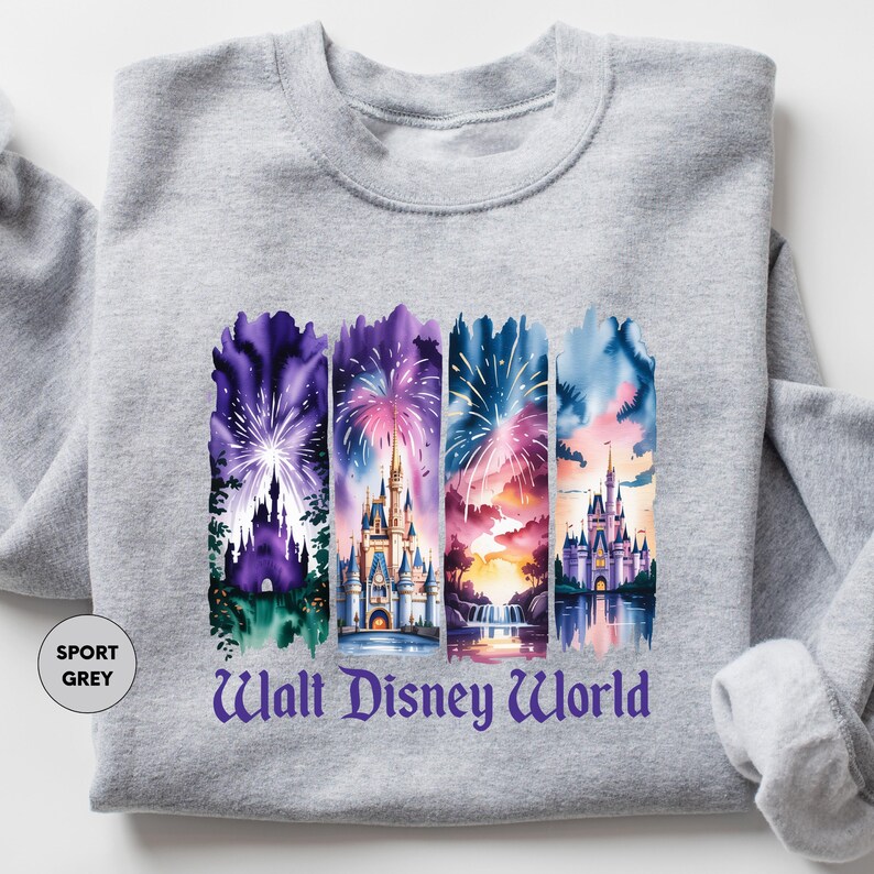 A gray sweatshirt with a graphic design featuring four colorful castle scenes and fireworks.