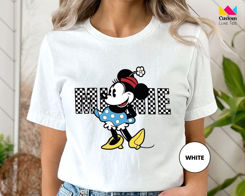 a woman wearing a mickey mouse t - shirt