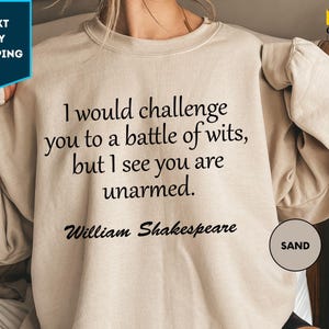 a woman wearing a sweatshirt that says i would challenge you to a battle of wits