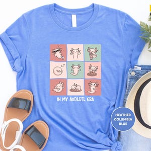 a t - shirt with a picture of cats on it